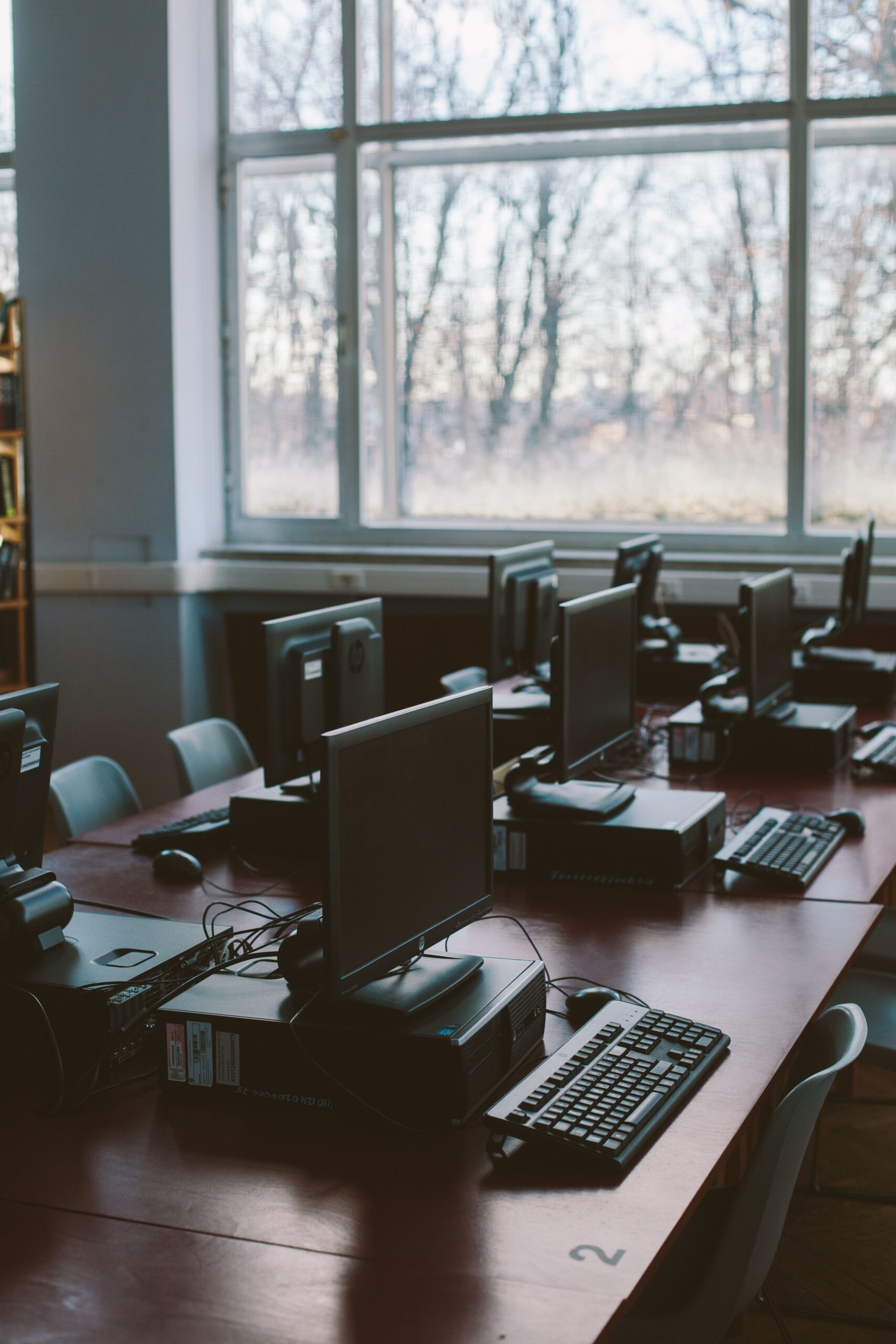 School computer lab with desktop workstations symbolizing IT support for managing labs, Wi‑Fi, and devices in Kenya.
